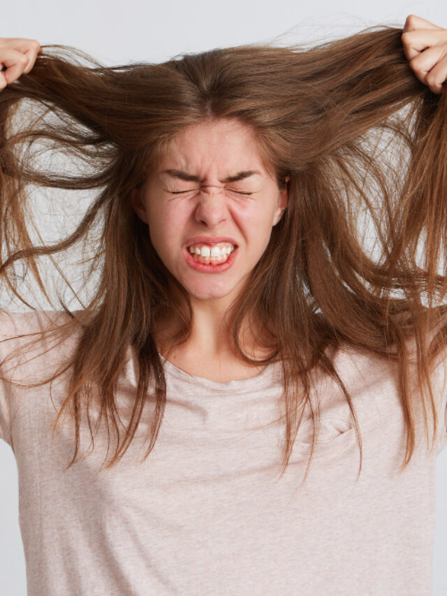 portrait-mad-crazy-young-woman-pulling-out-her-hair